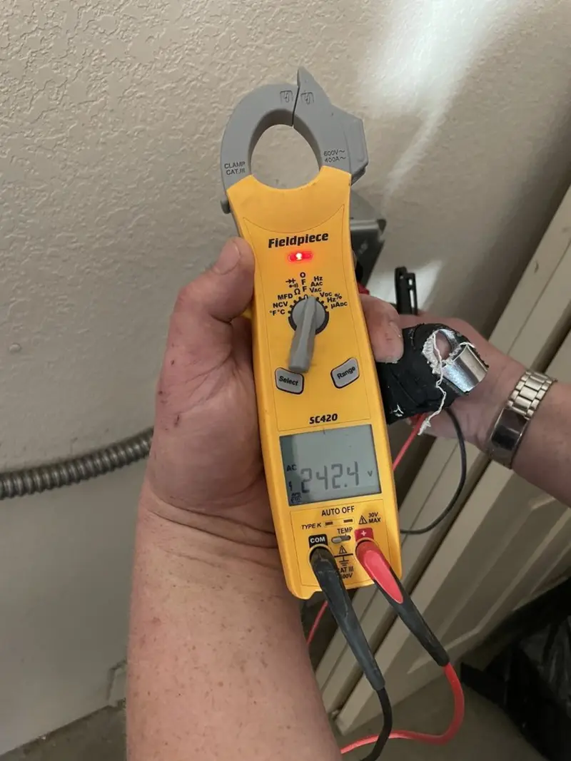 Voltage testing with clamp meter during Outlet Installation in Bensalem